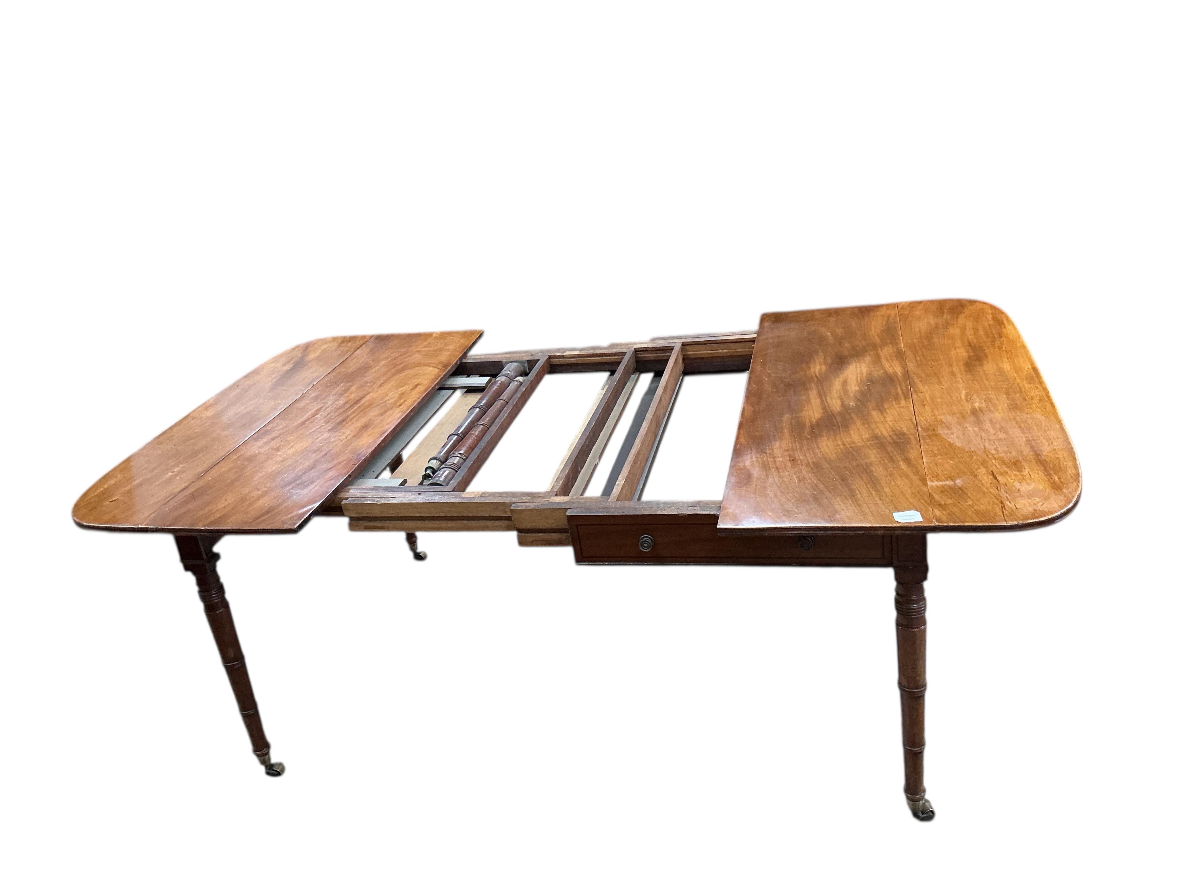 A Regency mahogany Pembroke extending dining table, width 258cm extended, depth 114cm, height 73cm